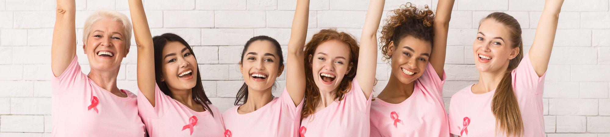 women in pink T-shirts for breast cancer awareness